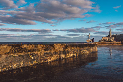 Panoramic view of sea and buildings against sky