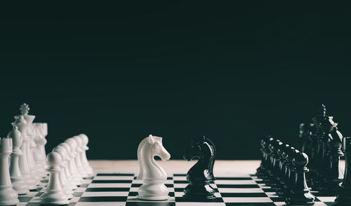 Full frame shot of chess board against black background