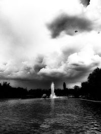 View of lake against cloudy sky