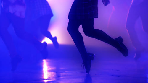 Low section of people at illuminated nightclub