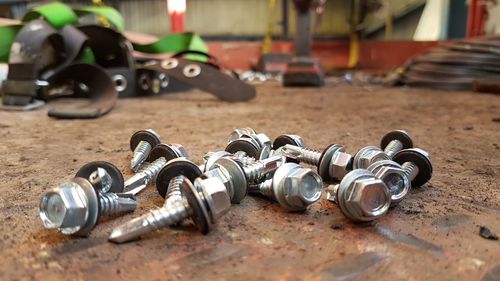 Close-up of nut bolts on rusty metal