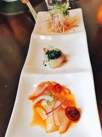 High angle view of fish served on table