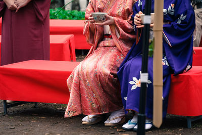 People in traditional clothing standing outdoors