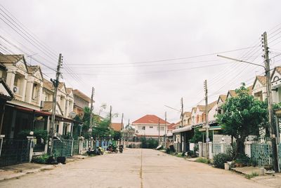 Street amidst buildings against sky