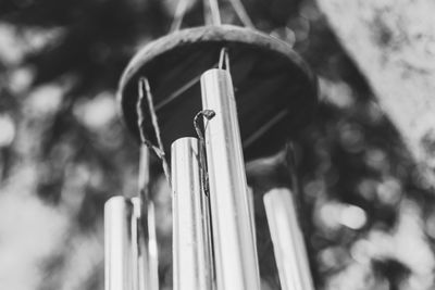 Low angle view of cross hanging on wood