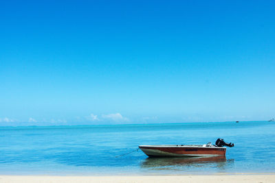 Boat in sea against sky