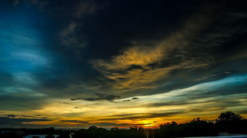 Low angle view of dramatic sky during sunset