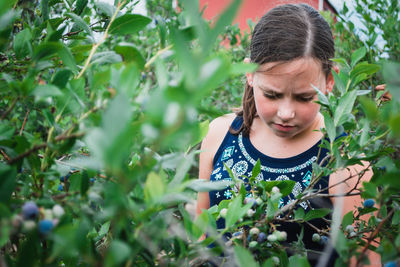 Close-up of girl with plants