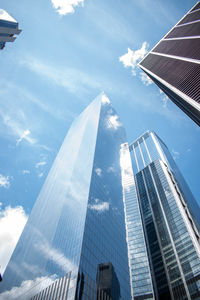 Low angle view of modern buildings against sky