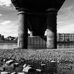 View of bridge over river in city