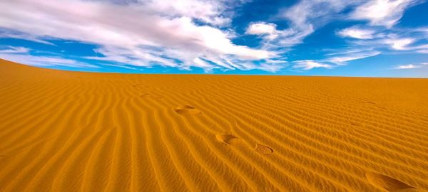 Scenic view of desert against sky