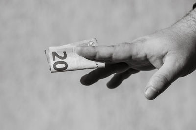 Cropped hand of person holding key