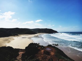 Scenic view of sea against blue sky