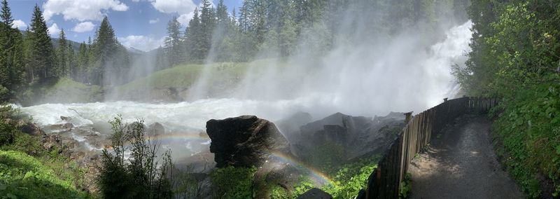 Panoramic view of waterfall in forest