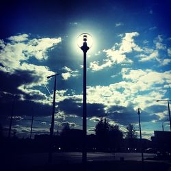 Low angle view of street light against sky