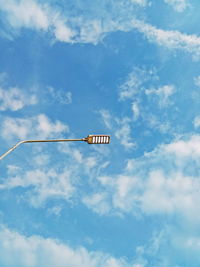 Low angle view of street light against sky