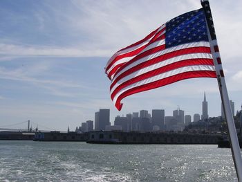 American flag in front of modern building
