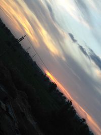 Low angle view of dramatic sky during sunset