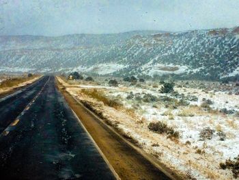 View of empty road along landscape