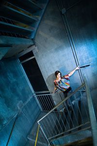 Low angle view of woman standing on steps
