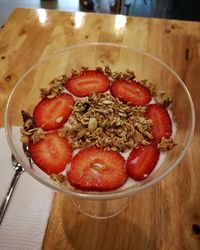 High angle view of strawberries in bowl on table