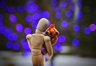 Close-up of hand holding illuminated lights