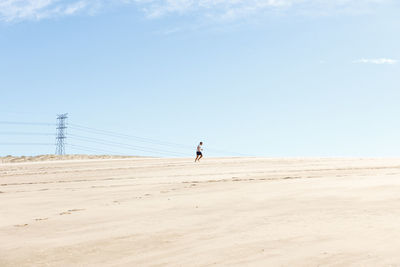 Full length of man on desert against sky