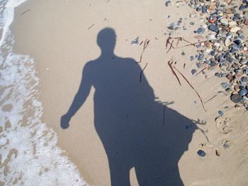 Shadow of person on sand