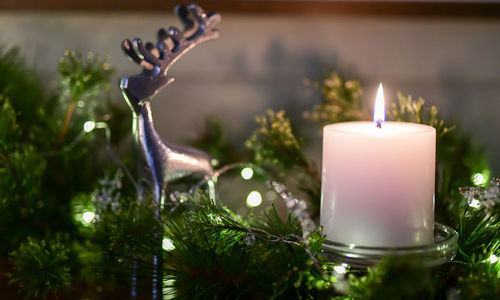 Close-up of illuminated tea light candle