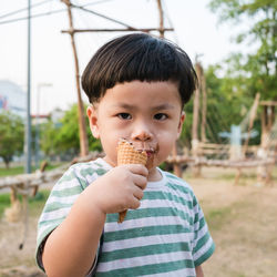 Portrait of cute boy eating ice cream