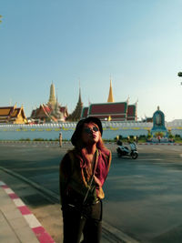 Full length of woman standing at temple