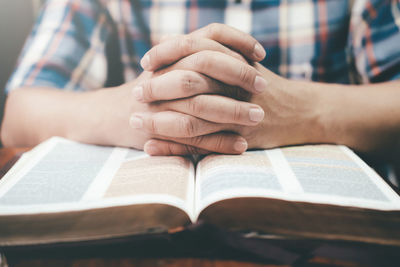 Close-up of woman reading book