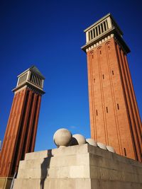 Low angle view of building against blue sky