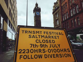 Close-up of information sign in city