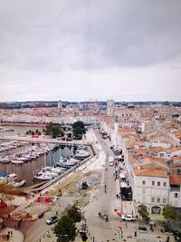 High angle view of street and buildings against sky