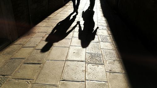 Low section of people walking on footpath