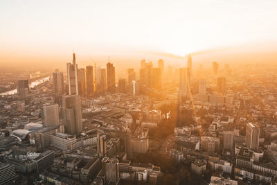 High angle view of modern buildings in city against sky