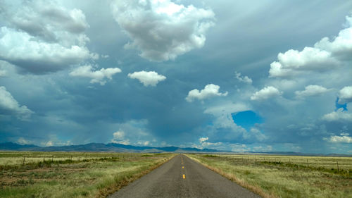 Open road with a storm on the horizon