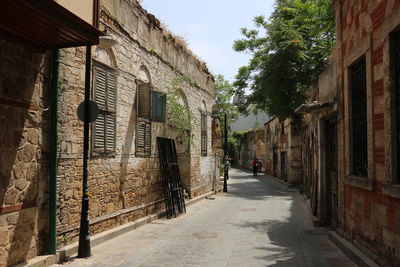 Narrow street amidst buildings in town