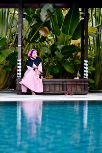 Portrait of young woman in swimming pool