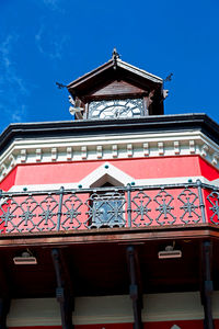 Low angle view of red building against sky