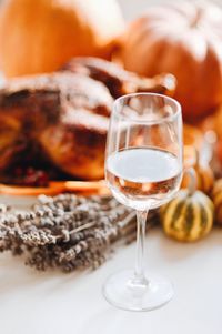 Close-up of wine with food on table