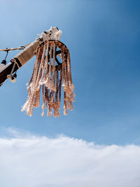 Low angle view of decoration hanging against sky