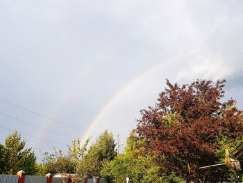 Low angle view of rainbow against sky