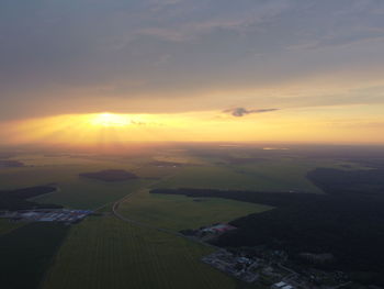 Aerial view of landscape against sky during sunset
