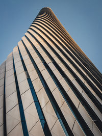 Tall modern office tower at sunrise