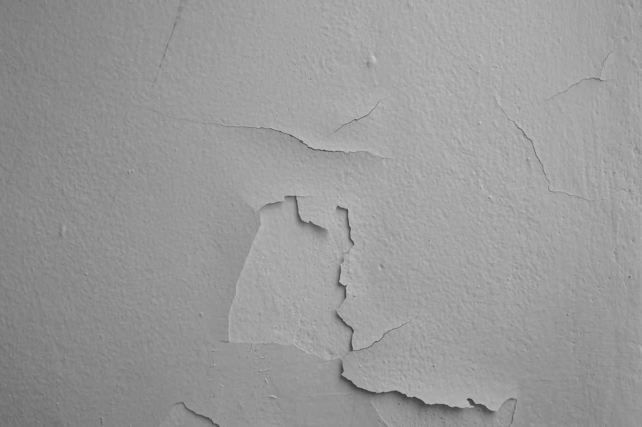 CLOSE-UP OF PEELED WALL