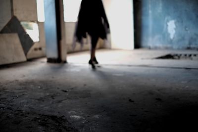 Low section of woman walking outdoors