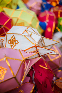 Close-up of coloured paper lanterns.