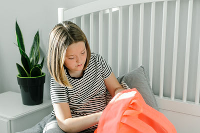 Woman looking through backpack